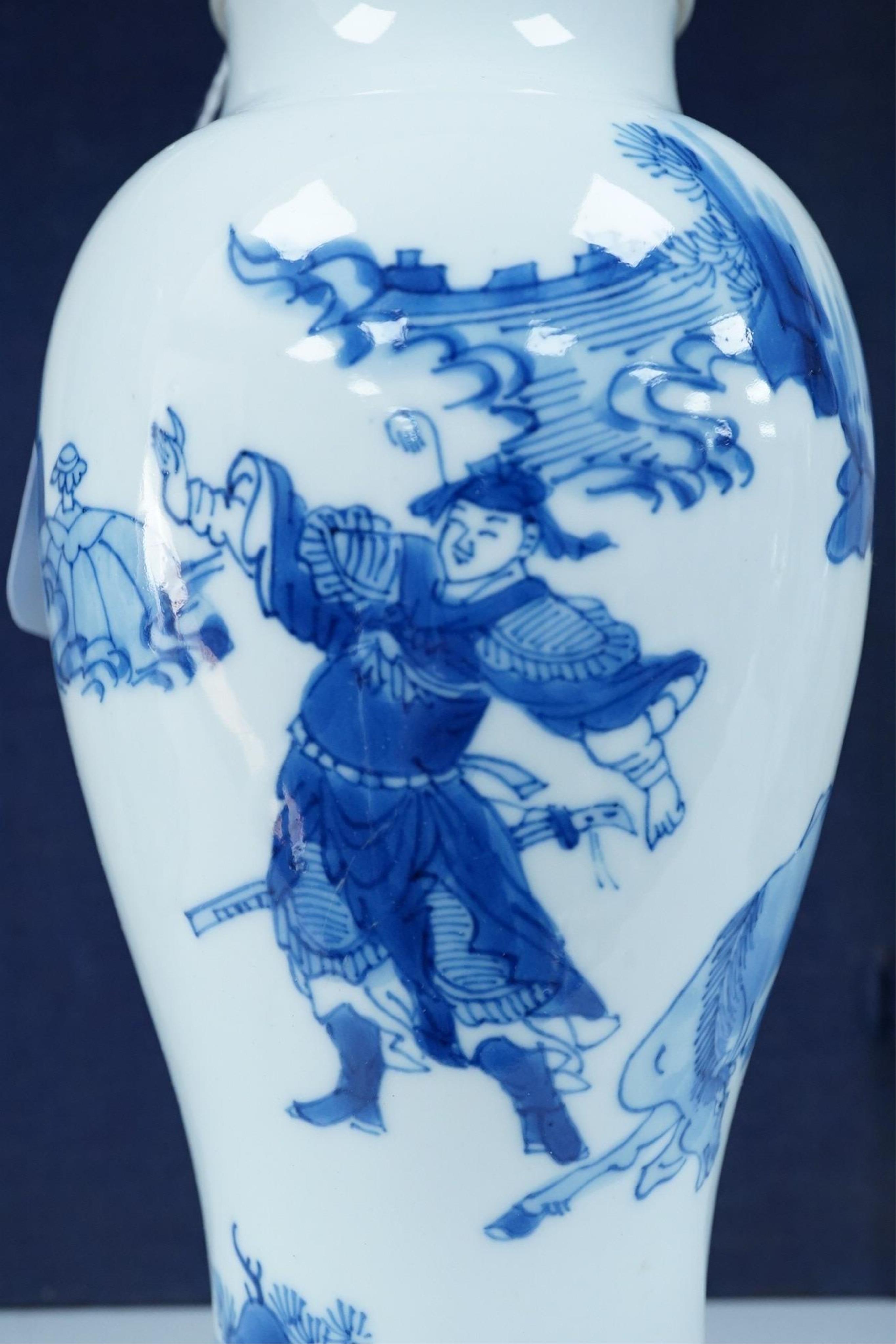 A Chinese blue and white baluster vase, early Kangxi, and associated cover